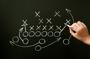 Explains the strategy for football and signifies the strategy needed in business exit planning.